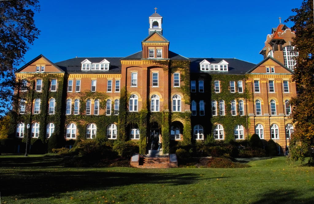 Colleges have no incentive to reduce costs when they know financial aid will increase to keep up, Hinkle writes. Above, St. Anselm College, a private school in New Hampshire, costs students $49,376 per year including tuition, fees, room, and board. 